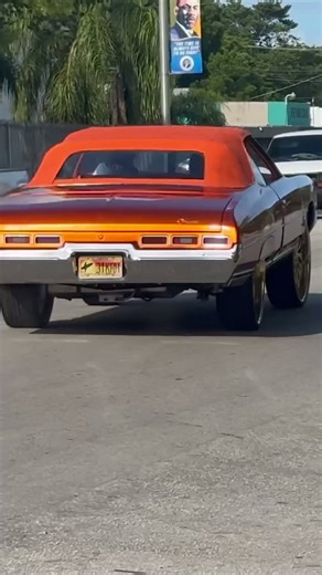 Candy orange '71 Chevy Impala on gold 28’s Savinis riding