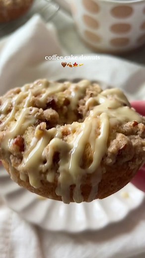 these coffee cake donuts are sooo warm & cozy 🤎 they’re topped with a crunchy pecan crumble and sweet maple glaze that’ll make your kitchen smell like fall 🍂🍁 Pecan crumble: 1/3 cup flour 1/4 cup sugar 1/4 cup chopped pecans 1 tsp cinnamon 3 tbsp softened butter Batter: 1/4 cup sugar 1/4 cup brown sugar 1 egg 1/4 cup sour cream or yogurt 1/4 cup melted butter 1 tsp vanilla 1 cup flour 1/2 tsp cinnamon 1/2 tsp baking powder 1/4 tsp baking soda 1/4 tsp salt Glaze: 1 1/2 cups powdered sugar 2 tb