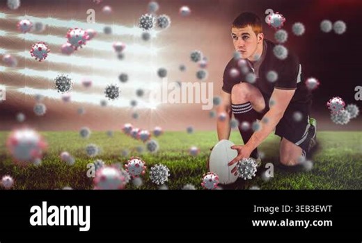 Animation of falling covid 19 cells over american football player. Global covid 19 pandemic concept, digital generated video.