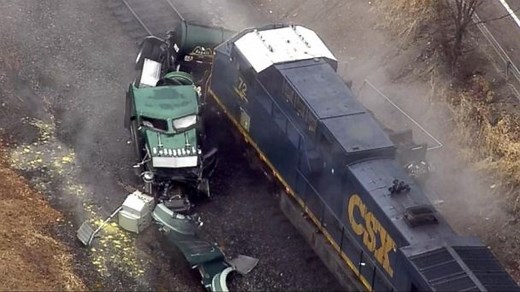 Freight train slams into tanker truck carrying hydrochloric acid