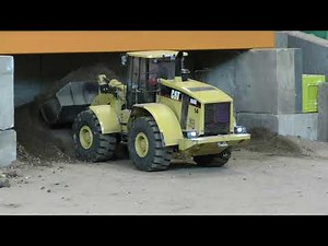 CAT 966G stockpills top soil