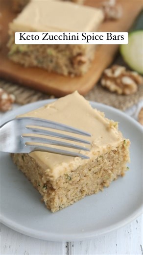 Top these Keto Zucchini Bars with a rich caramel cream cheese frosting for a delightful low carb treat. https://alldayidreamaboutfood.com/keto-zucchini-bars/ They are sweet and tender, and a great way to use up some of that summer zucchini! And they have only 2.8g net carbs per bar. #zucchini #zucchinirecipes #ketobaking #lowcarbdessert | All Day I Dream About Food
