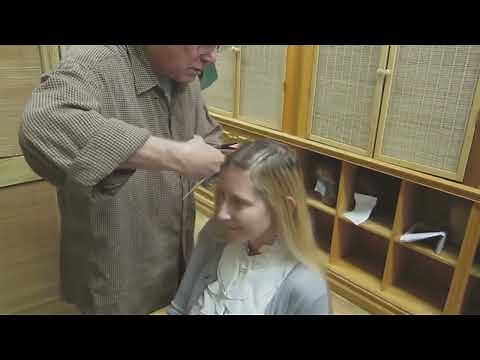 Blonde woman cuts her long blonde hair to a short buzz cut