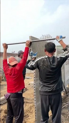 the process of installing long concrete blocks to make a building fence #construction #viralshorts