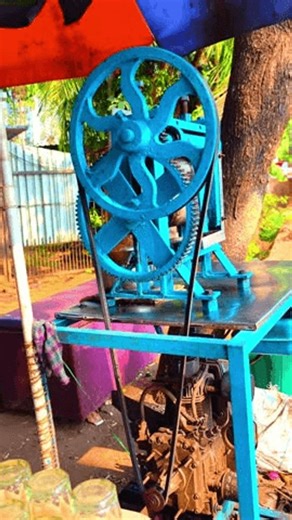 clip-4004772761-close-up-view-traditional-sugarcane-juice-extraction-machine