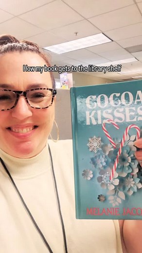 I got to hang out at the @city_of_mission_viejo_library store all morning yesterday behind the scenes, listening and researching so I can write some library and characters. I brought one of my large print editions from my publisher to add to their collection. And my delightful librarian friend humored me by putting my book through the process of getting on the shelf and joining its friends. #closeddoorromcom #sweetromcom #bookstagram #librarylove #librarybooks #smalltownromance | Melanie Jacobso