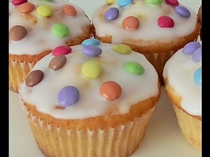 Delicious vanilla cupcakes with Smarties