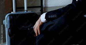 Businessman removing shoes in hotel room