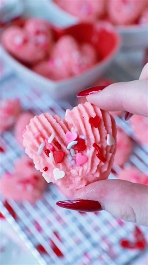 These pink, heart-shaped spritz butter cookies are perfect for Valentine’s Day! This recipe for butter cookies has been in my family for decades and never disappoints! These soft butter cookies are made with butter, sugar, eggs, and a secret ingredient – mayonnaise! It makes the cookies extra soft and delicious! Add some Valentine’s Day sprinkles on top to make the cookies look extra special for the holiday! Get all the recipe details and watch my full-length YouTube video tutorial on my website