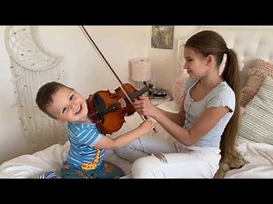 My 2 year-old brother wants to play a full size violin. I am teaching him!!!