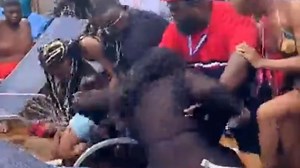 Shocking moment man batters a woman in mass brawl on Carnival Cruise ship