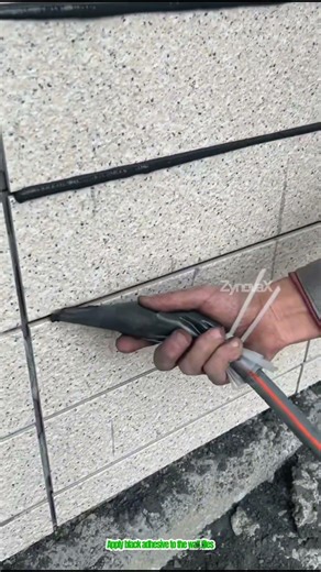 Apply black adhesive to the wall tiles