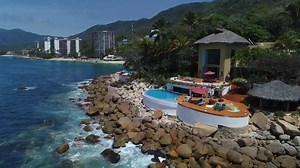 3.4K views · 303 reactions | Incredible waterfront villa crafted with a dramatic great room with a living tree meandering all the way through the roofline and the appearance of a palapa ceiling and roof, walls of glass open up to expansive outdoor living areas and panoramic views of the Bay of Banderas and the entire coastline all the way to Punta Mita! Listed by Tropicasa Realty for $4,750,000 LuxuryRealEstate.com/3247920 | LuxuryRealEstate.com | Facebook