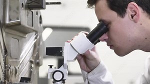 Quality Engineer Checks Deficiencies on the Injection Mold by a Microscope, Checking the Technical Condition of the Injection Mold in Automotive Factory, Close Up, Industrial Concept