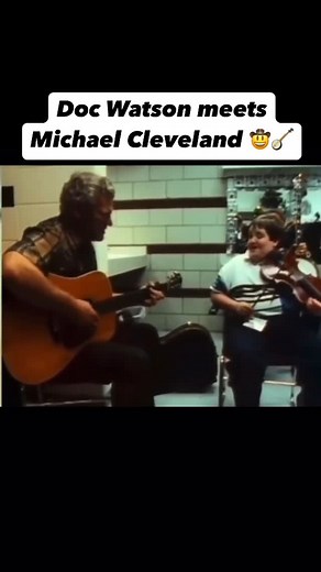 Bluegrass Music on Instagram: "Follow us @BluegrassCountry for more‼️🤠🪕 Doc Watson, the legendary bluegrass and folk guitarist, first met Michael Cleveland, an immensely talented #fiddler, at a time when Cleveland was still a young up-and-coming musician. The encounter marked a special moment in the world of roots #music. Cleveland, known for his virtuosic fiddle playing, was influenced by the sounds of traditional bluegrass and admired Watson’s mastery of the genre. Watson, ever the humble an