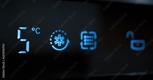 Adjusting temperature of refrigerator on kitchen. Decreasing the temperature on digital LCD display of refrigerator. Reducing temperature from six to zero degrees Celsius. Cinema 4K 60fps video