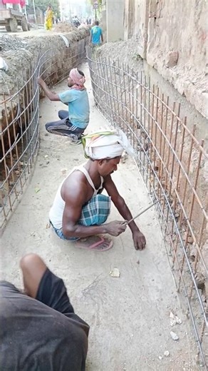 Binding Reinforcement Rods at Construction Site #RebarWork #ConstructionSite