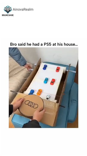 AinovaRealm on Instagram: "The post humorously juxtaposes a friend's promise of a PS5 with a video of two people playing a DIY cardboard race track using toy Audi cars, emphasizing wholesome, low-tech fun over high-end gaming. From @NoContextHumans , a popular account curating absurd human moments, the clip—posted on December 17, 2025—quickly amassed 355,000 views and 1,700 likes, resonating for its nostalgic creativity. User replies celebrate the setup as superior to consoles, reflecting broade