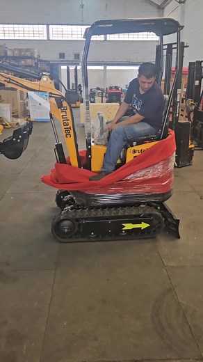 Mini Excavator Operation in Industrial Warehouse Setting
