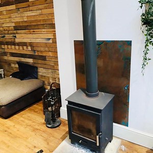 Copper Wall Panels: The Perfect Partner to Wood Burning Stoves - Halman Thompson