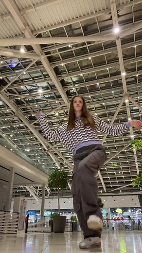 Shopping Mall Dance Routine with Striped Sweater