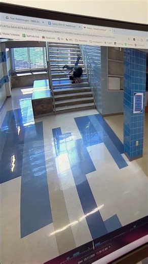 Teen slips and rolls down school stairs but quickly recovers in Austin, Texas, USA
