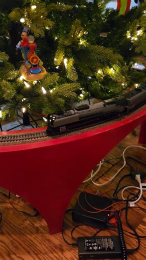 2-Rail Nation on Instagram: "The HO Christmas tree train loop didn't make it through storage so I had to make a few repairs. Track is back in gauge and the trains are running perfectly 👌. HO scale @broadwaylimited FEF-3 Union Pacific #840 pulling two sets of @mthtrains heavyweight UP passenger cars. Powered by the same NCE Powercab as the N scale loop! #hoscaletrains #hoscale #christmas #christmastrain #christmasdecorations #christmastree #nscale #nscalenation #2railnation #modeltrains"