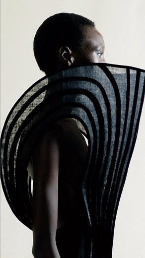 Black corset dress with low-cut back and molded screen collar made of velvet strips applied to a banana fiber canvas base. | Ashi Studio