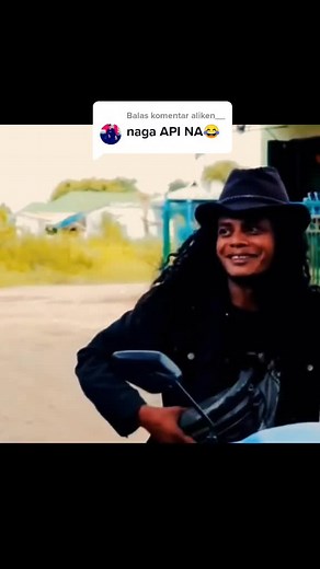 Riding a Blue Motorcycle Through Scenic Greenery