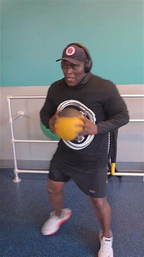 Boxing Exercise, using medicine ball to train at Pure Gym. Fitness is vital regardless of age.