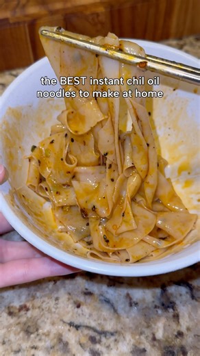 Julia on Instagram: "These are the baijia a-kuan Sichuan chili oil wide noodles, they’re sooo easy to make and so good, similar to hand pulled noodles but at home! I got this pack from ranch 99 :) #foodie #instantramen #noodles"