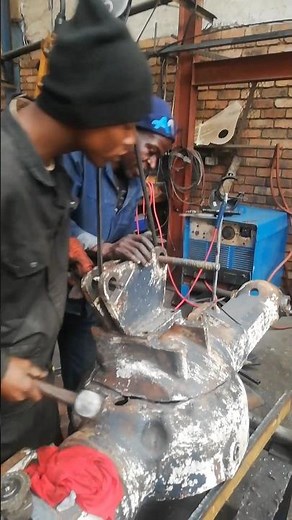ADJUSTING CRACKED CATERPILLAR'S DIFFERENTIAL HOUSING USING HAMMER AND OVERHEAD CRANE PRIOR WELDING