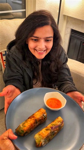 Aishani & Bhavya ✈️ Travel Couple on Instagram: "We’re proper foodies. We LOVE good food. But when we’re eating at home, we try to keep things lighter and cleaner. So when the craving for deep-fried spring rolls hits, there’s always that second thought — “I want them… but I don’t want the guilt after.” And that’s when we find a middle ground. Same craving, smarter version, and everyone’s happy 🤍 If you’re new here — We’re Aishani & Bhavya, sharing everyday couple life, food moments, and the lit