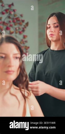 beautiful brunette woman doing hairstyle with her hair Stock Video Footage - Alamy