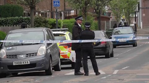 Police guard forensics tent day after 14-year-old boy killed in Woolwich