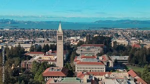 A scenic view of the University of California Berkeley Campanile, with San Francisco and the Bay in the background. A popular tourist destination in the USA.