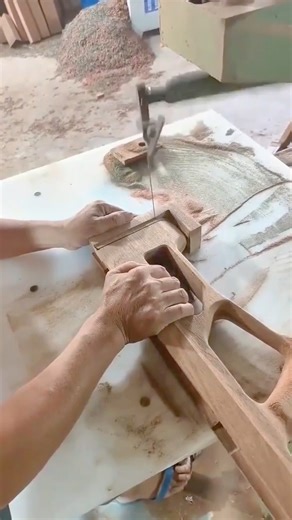 Fine Woodwork Crafting Detail with a Coping Saw on a Wooden Piece