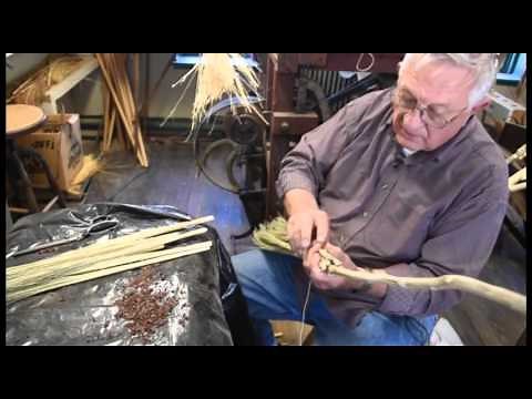 Making a broom by hand with broom corn.