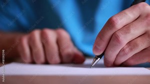 Man writing a letter by left hand and crumpling a paper