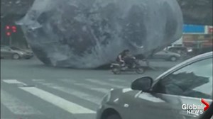 A giant inflatable moon wreaked havoc on the Chinese city of Fuzhou Wednesday as stunned commuters looked on. LEARN MORE: http://globalnews.ca/news/2942465/runaway-giant-inflatable-moon-wreaks-havoc-on-chinese-city/?sf36015369=1 | Global News