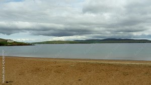 Remote island beach time lapse panning with cloud movement