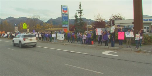 As Anchorage schools face closure to enrollment drops, crowd protests teacher contracts outside board meeting