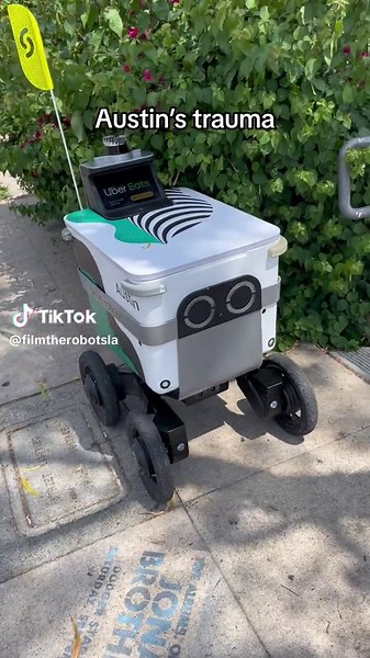 Confronting Austin the food delivery robot about his trauma.