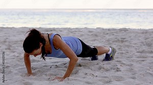 Woman exercising on the beach