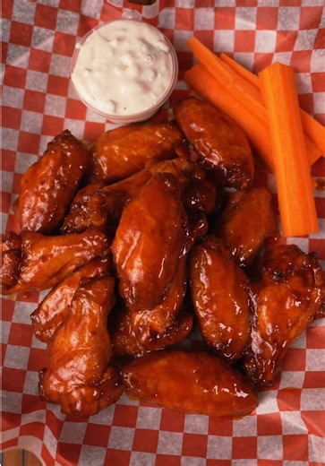 Baked Buffalo Wings for the big game. 🏈 Ingredients - 2 lb wings - 1 tbsp olive oil - 1 tbsp garlic powder - 1/2 tbsp smoked paprika - 1/2 tbsp cayenne pepper - 1/4 tbsp salt - 1 tbsp corn starch - Blue cheese - More blue cheese The Sauce - 1/4 stick of butter - 1 cup franks red hot sauce - 1/4 cup honey Instructions Pat your wings dry then season. Place them on a wire rack so air can circulate. Place them in the fridge for a few hours. Pre heat oven to 375 and cook until they hit 190 internal.