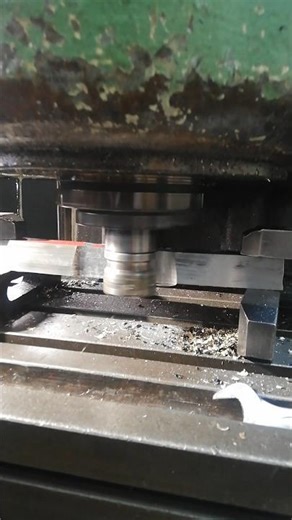 CHIPS FROM MILLING MACHINING TENSILE SAMPLE IN MECHANICAL WORKSHOP PRIOR TENSION TEST
