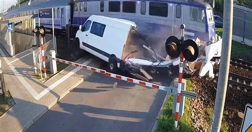Train slams into van at railway crossing in Poland