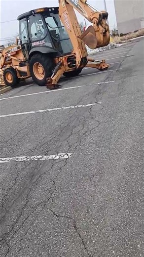 A Case Backhoe snow plow