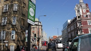 ULEZ stock footage London, UK - April 9 2019: ULEZ (Ultra low emission zone) London prepare Ultra Low Emission Zone (ULEZ) warning sign central London. 15 minute city town planning