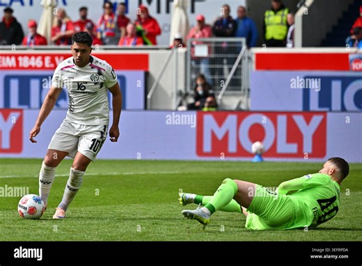 16 May 2026, Baden-Württemberg, Heidenheim: Soccer, Men: Bundesliga, 1. FC Heidenheim - FSV Mainz 05,Matchday 34, Voith-Arena. Nadiem Amiri (l, 1. FSV Mainz 05) scores the 0:2. Photo: Jan-Philipp Strobel/dpa - IMPORTANT NOTE: In accordance with the regulations of the DFL German Football League and the DFB German Football Association, it is prohibited to utilize or have utilized photographs taken in the stadium and/or of the match in the form of sequential images and/or video-like photo series St